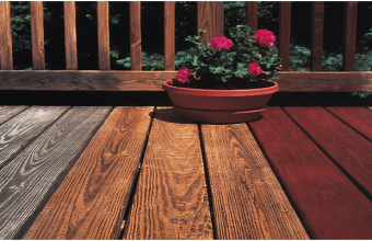 before and after image of dirty deck that has been stained and sealed